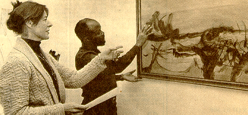 Caroline Haenggi from Gallery 21 with Stephen Ditshilwane discussing a work by Fred Schimmel on the gallery's 1984 exhibition (Rand Daily Mail, Johannesburg 31st May, 1984)